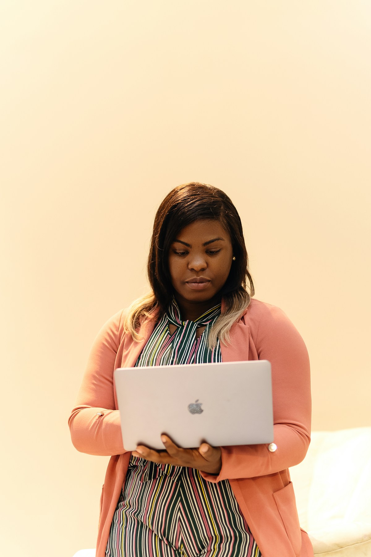 African IT support officer with laptop